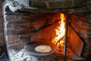 What Material Behind a Wood-Fired Hearth is Best?